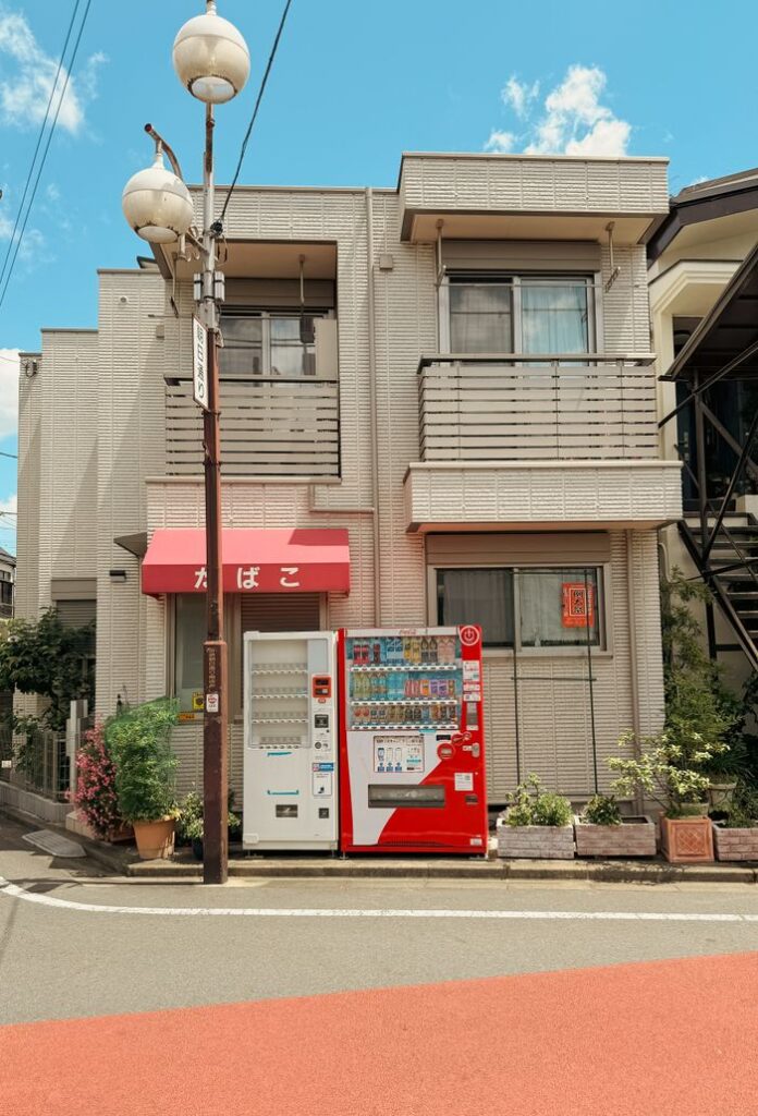 Crafting Captivating Headlines: Your awesome post title goes here A vending machine on a residential street in Tokyo, Japan under a clear blue sky.